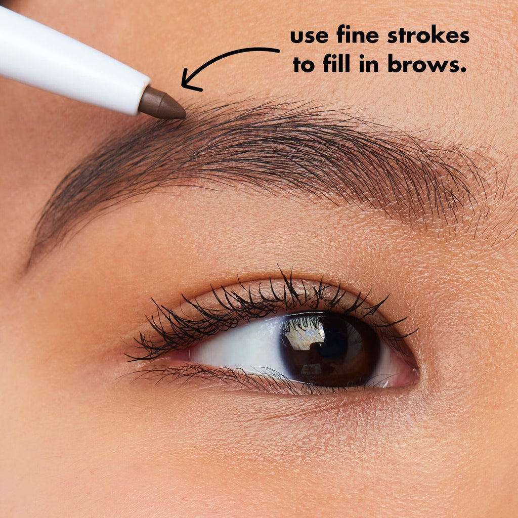 Model Applying Eyebrow Pencil